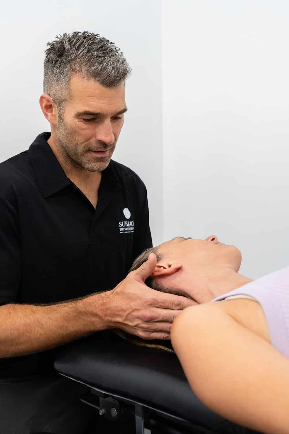 Neck care being administered to a patient by physiotherapist