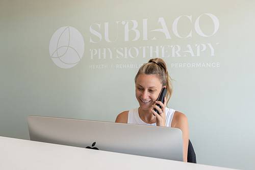 Receptionist at Subiaco Physiotherapy answering patient phone calls